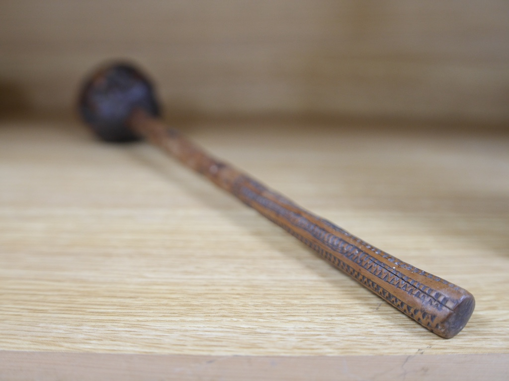 A Fijian hard wood throwing club, ula, with incised decoration to the handle, 41cm in length. Condition - fair to good